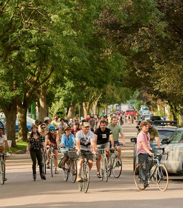 crowd of people on bikes in downtown Burlington