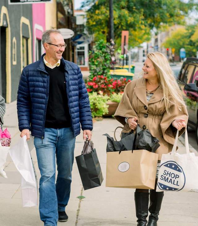 Man and two women shopping in downtown Green Bay