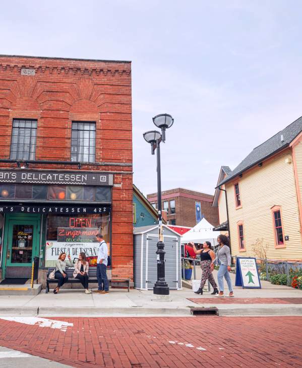 People walking outside Zingerman's Deli