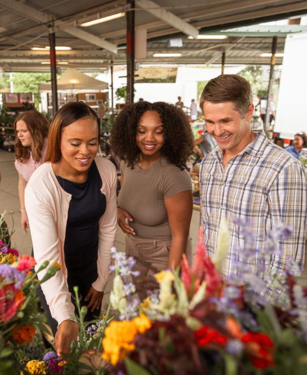 Group of people looking at items at the Ann Arbor Farmers Market