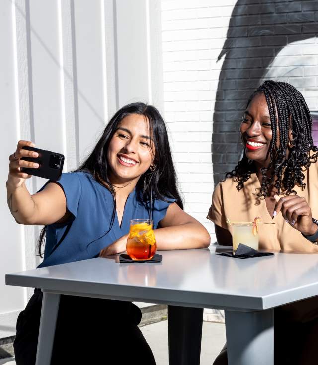 Two women taking a selfie of them enjoying cocktails at Haymount Truck Stop