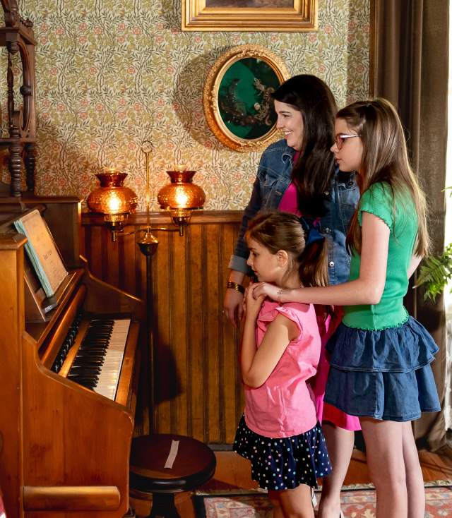 Image of family touring the 1890 Allen Poe House