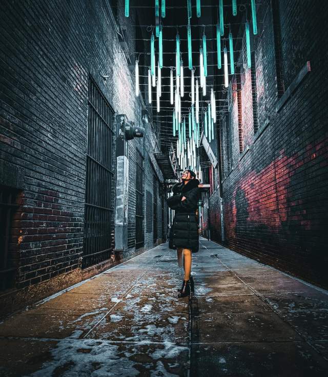 Woman under lights at 77 Steps installation