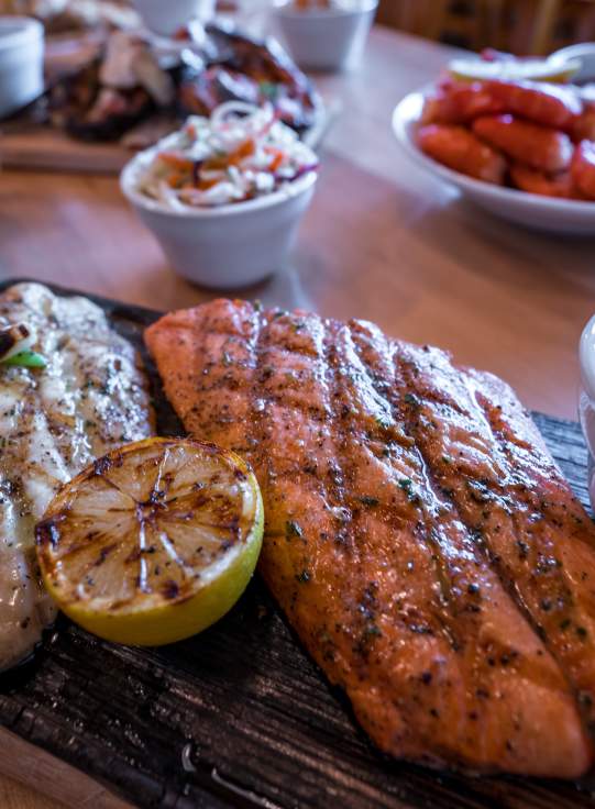 grilled salmon & halibut plated with lime and salsa