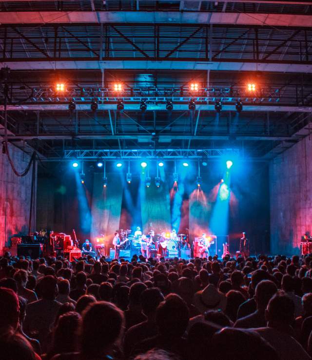 view of performers on stage from crowd