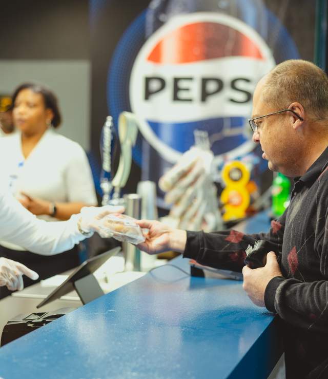 People purchasing snacks from concession stand