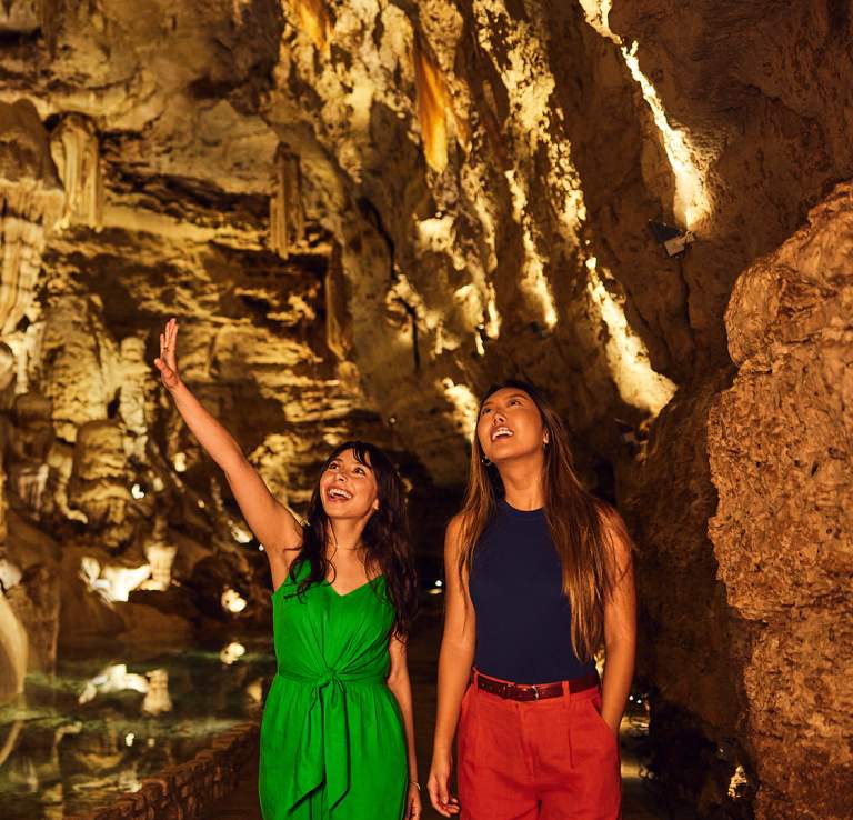 Two girls inside cavern