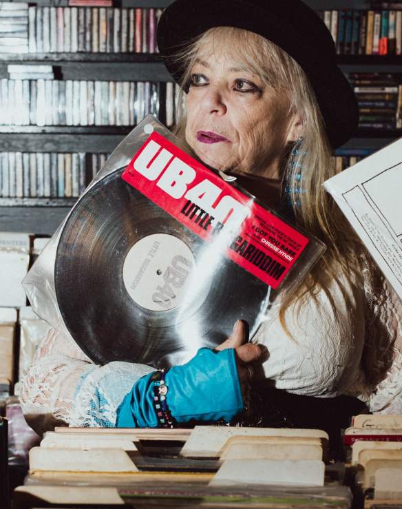 A person holding a vinyl record.