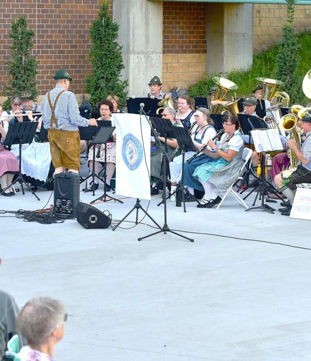 Bavarian Musikmeisters on the patio outside Central Park for Performance in the Park