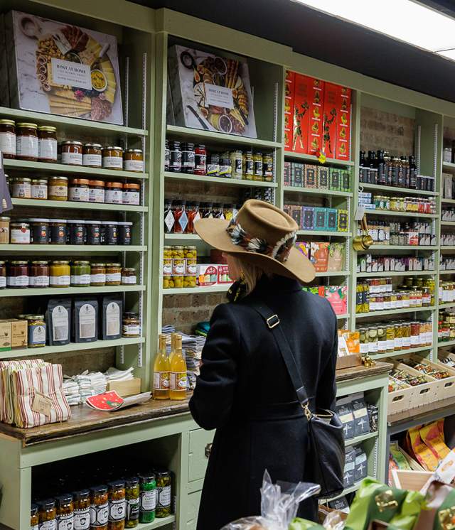 Woman in a hat shopping at the local food market.