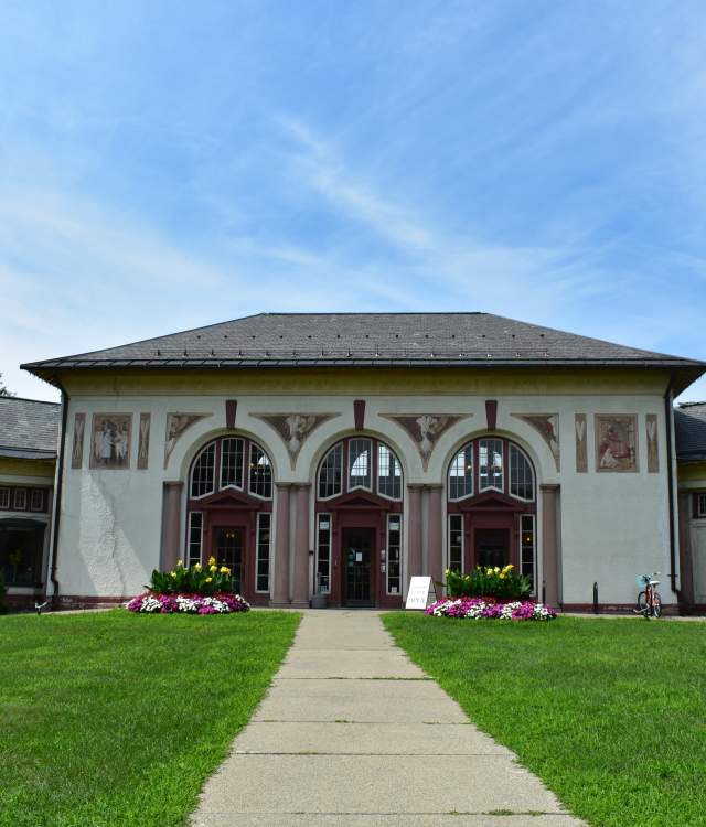 Saratoga Springs Heritage Area Visitor Center Exterior Shot, vivid green lawn and blue skies