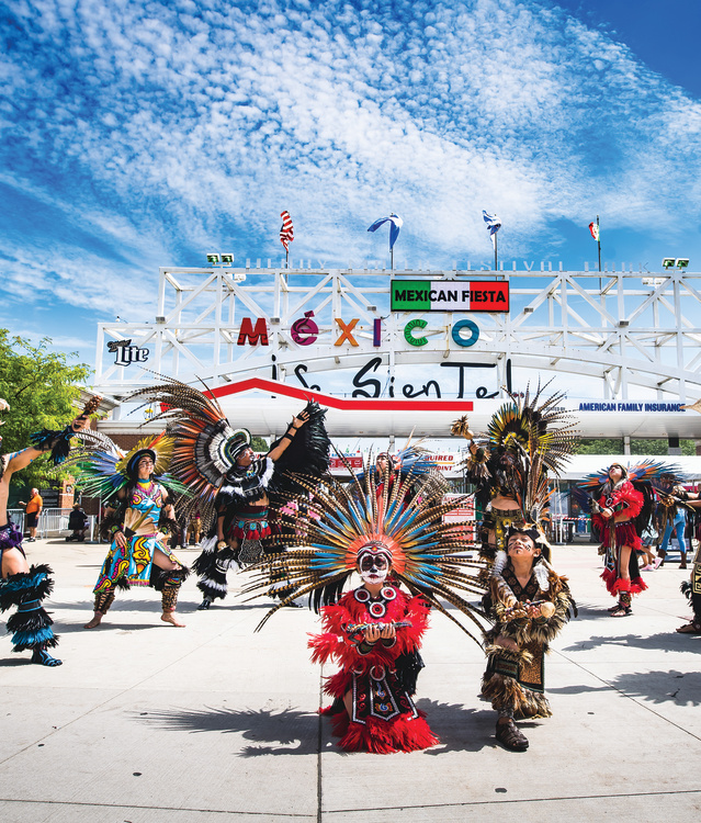 traditional Mexican dance in front of Mexican Fiesta festival grounds main gate
