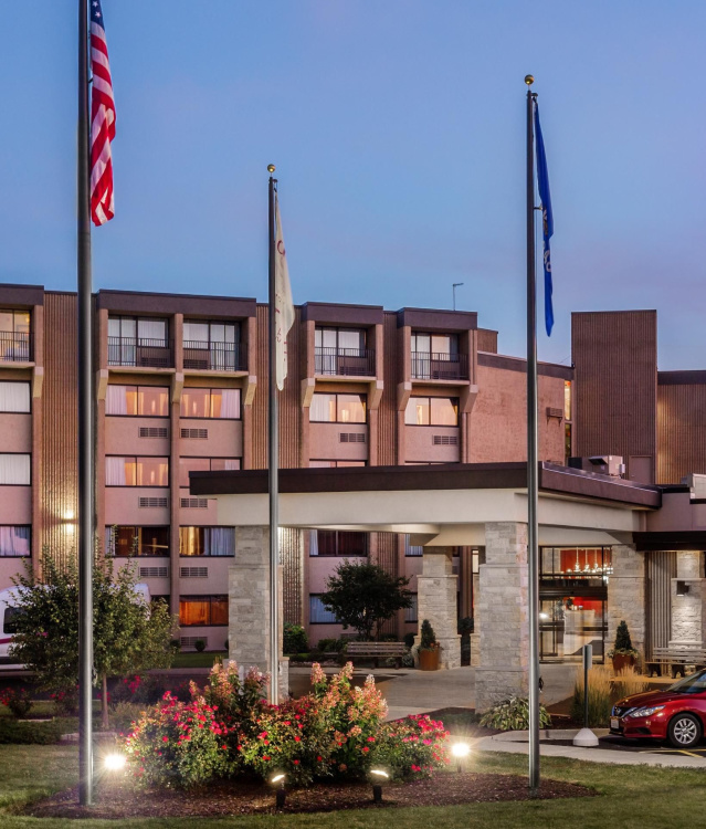 A view of the Crowne Plaza Hotel from it's parking lot at dusk