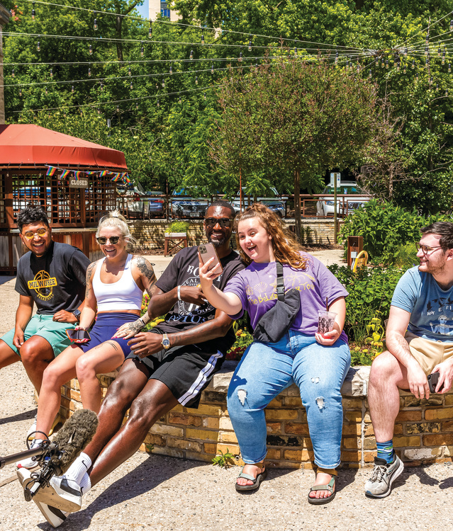 Bobby Portis taking a group photo with people at Colectivo