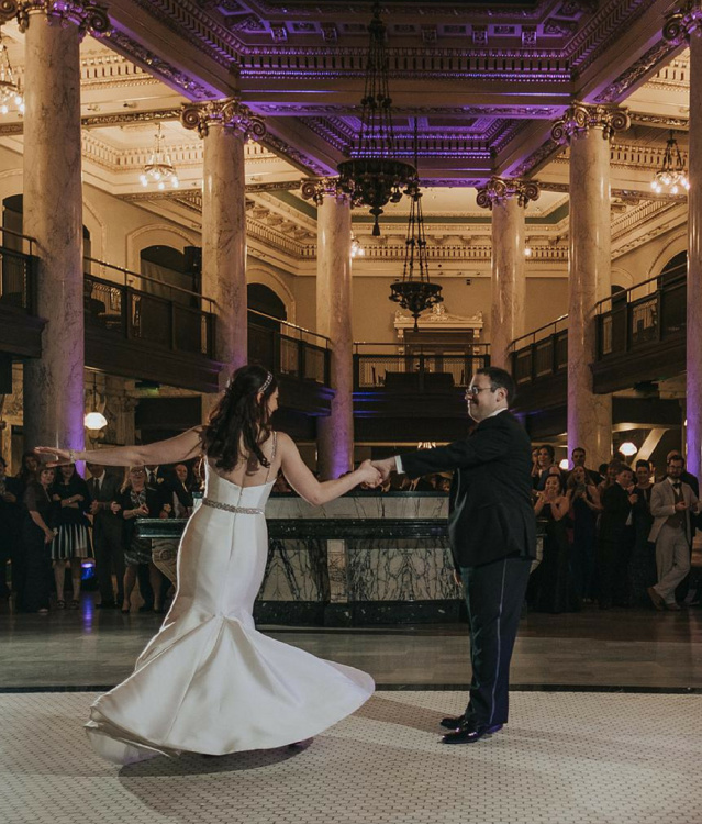 A married couple dancing during their wedding at the Milwaukee County Historical Society.