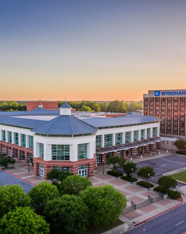 The sun sets behind the convention center in Fort Smith, Arkansas.