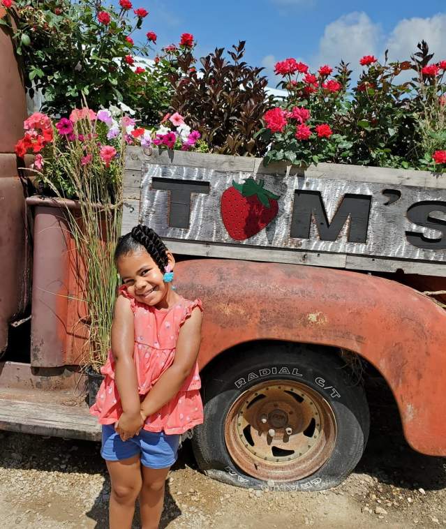 Little Girl by Tom's Farm Truck