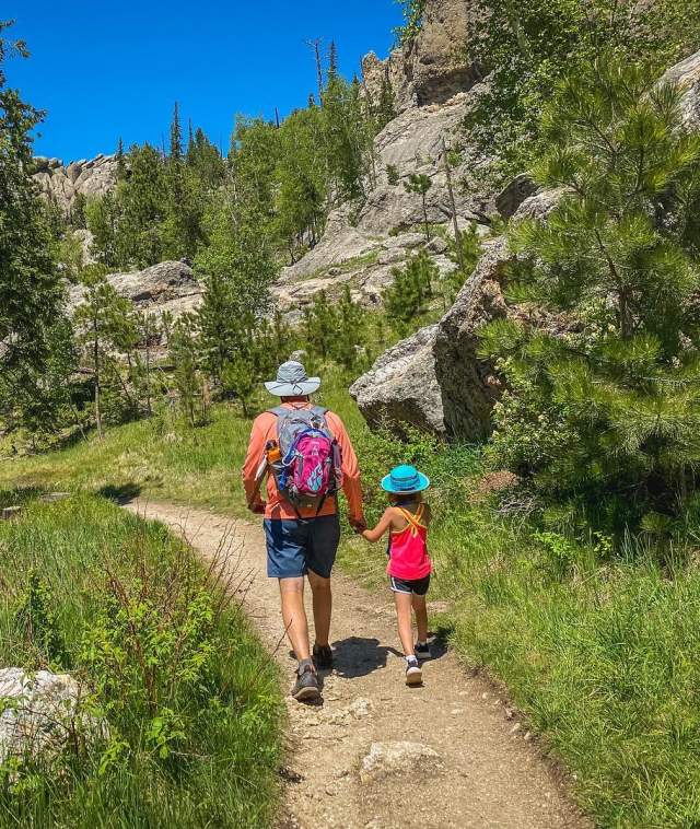 Man and daughter hiking in the black hills