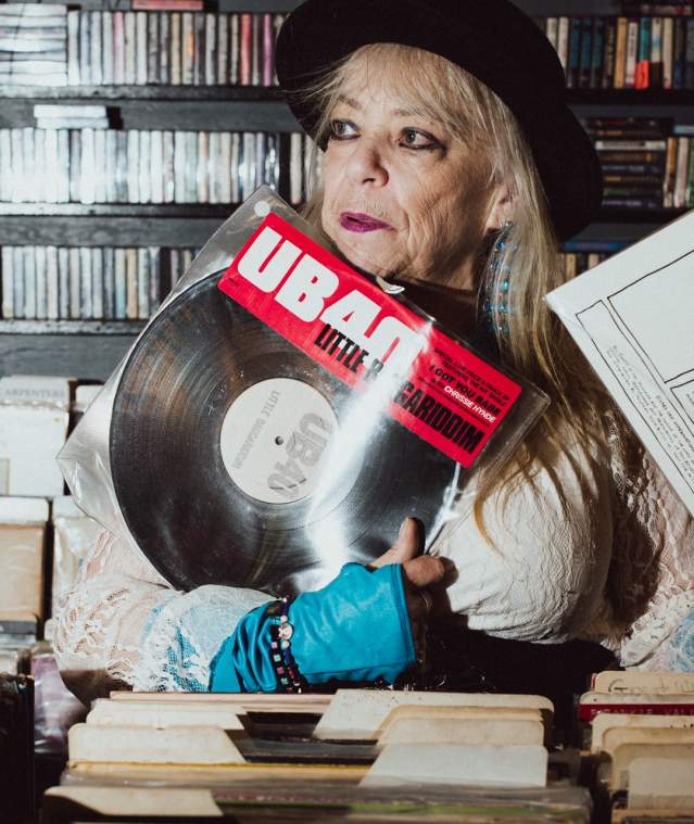 A person holding a vinyl record.