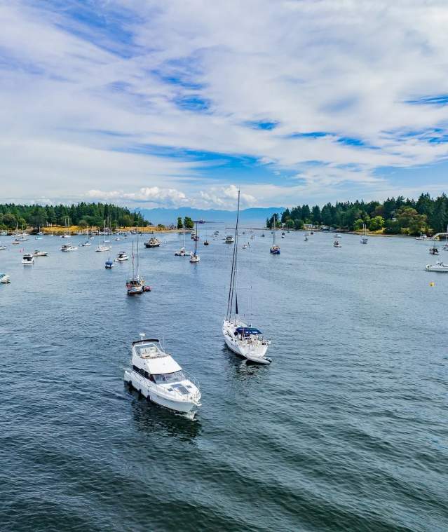 Two boats leaving the dock.