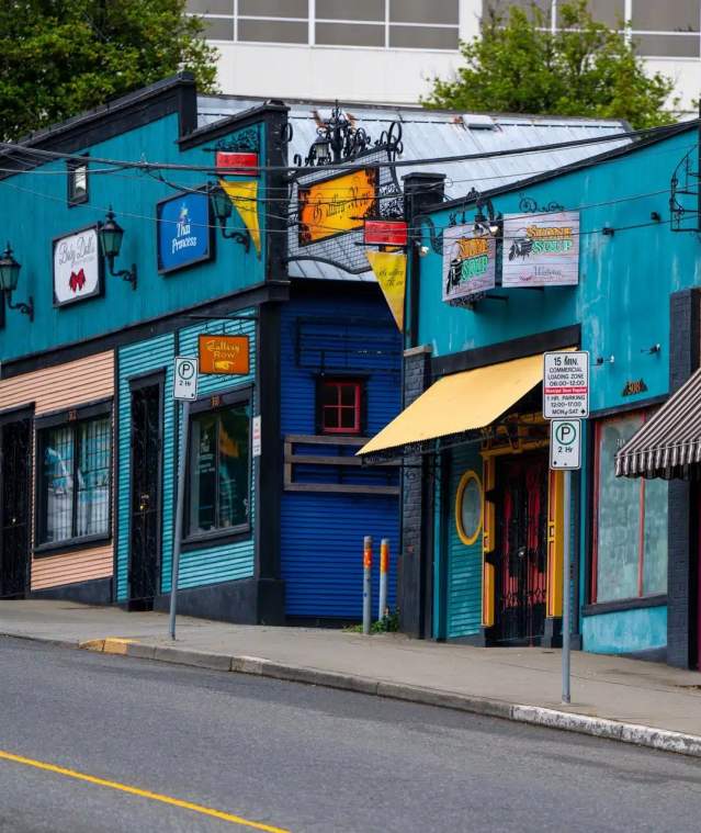 A row of colourful shops.