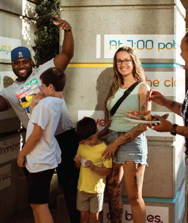 People having fun at an outdoor market.