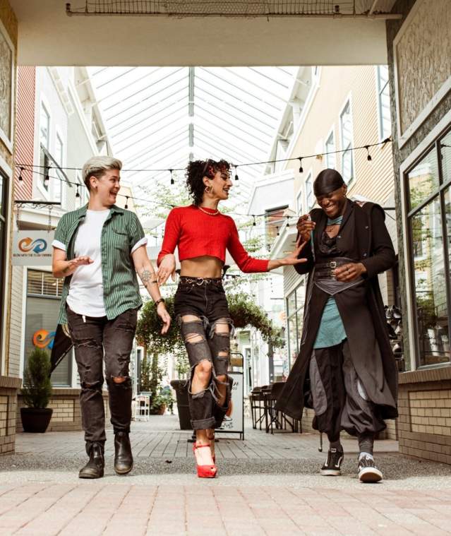 Three friends hanging out walking.