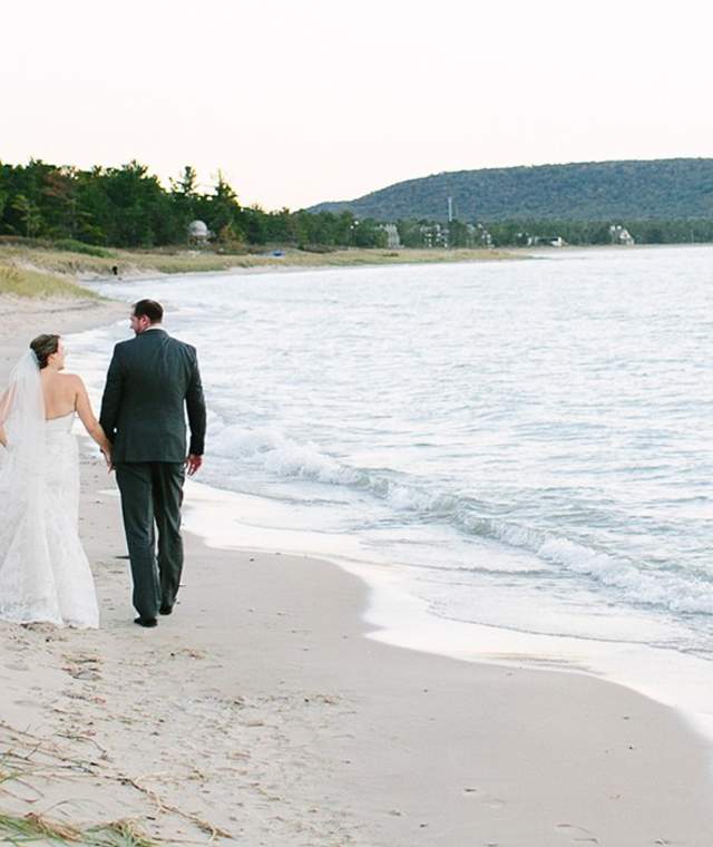 Wedding couple walking on beach
