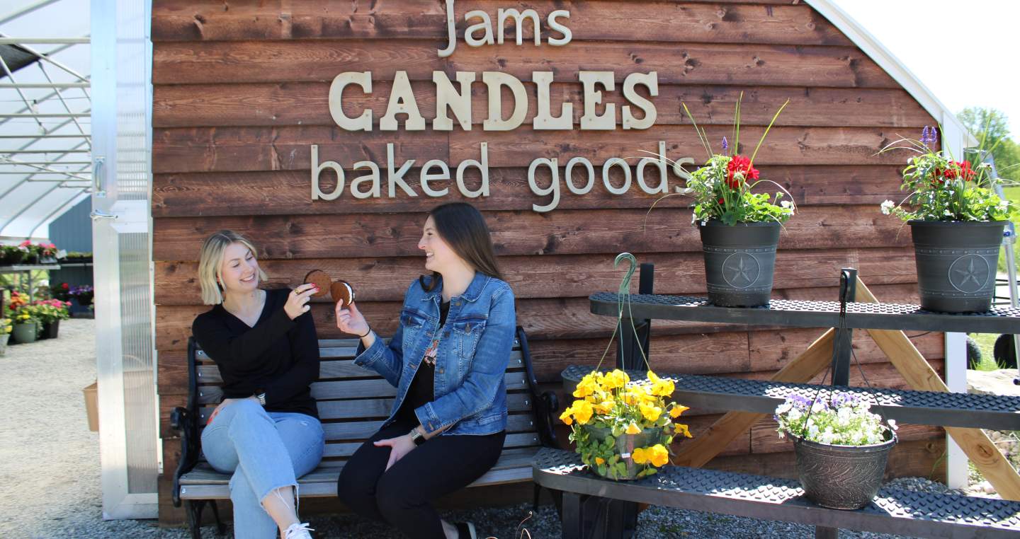 two women enjoying locally made ice cream at White Clover Farm