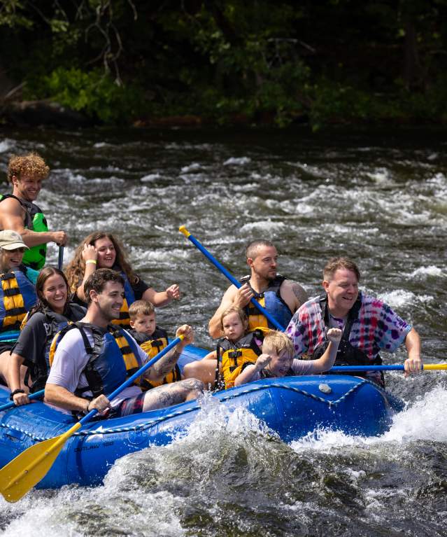 A group whitewater rafting with Adirondack Adventure Center