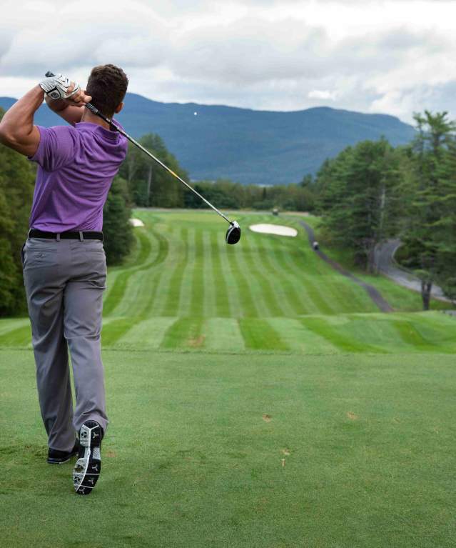 Man Teeing Off at the Golf Course