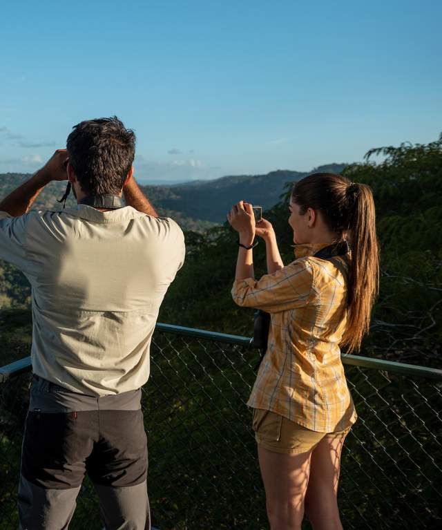 Couple birdwatching on the top of the Canopy Tower At Gamboa