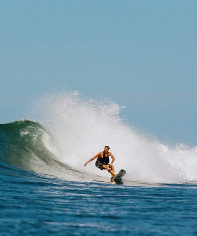 Surfer in Santa Catalina, Panama riding a tubular wave on the Pacific coast.