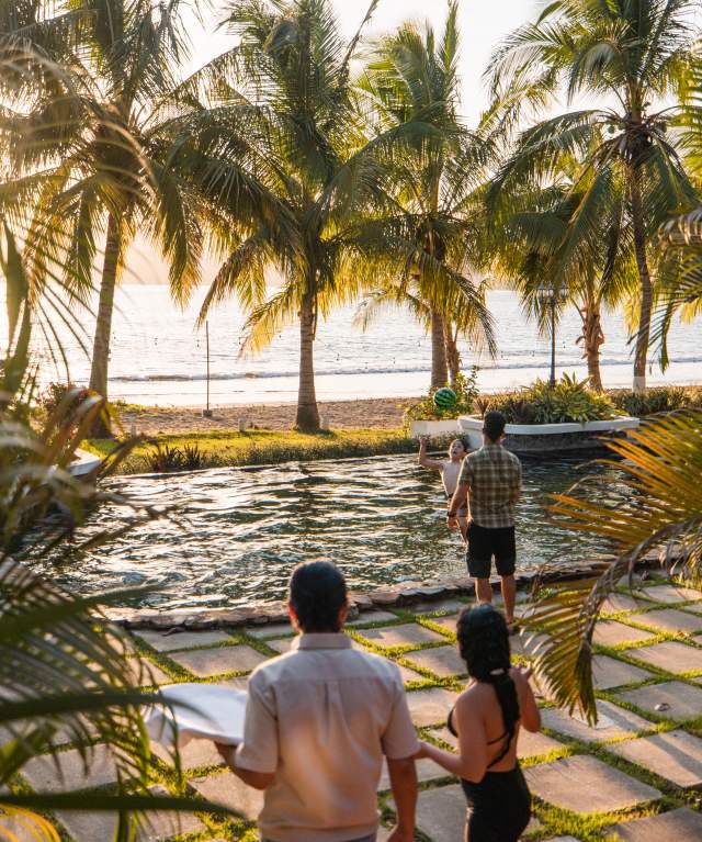 Tourists enjoying the swimming pool of a beachfront hotel in Pedasi, Panama.