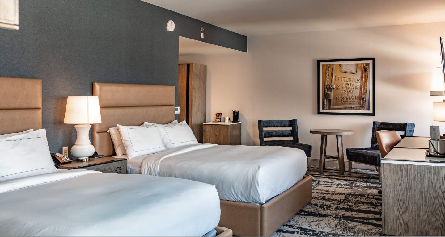 a guest room at the Yorktowne Hotel with two queen beds