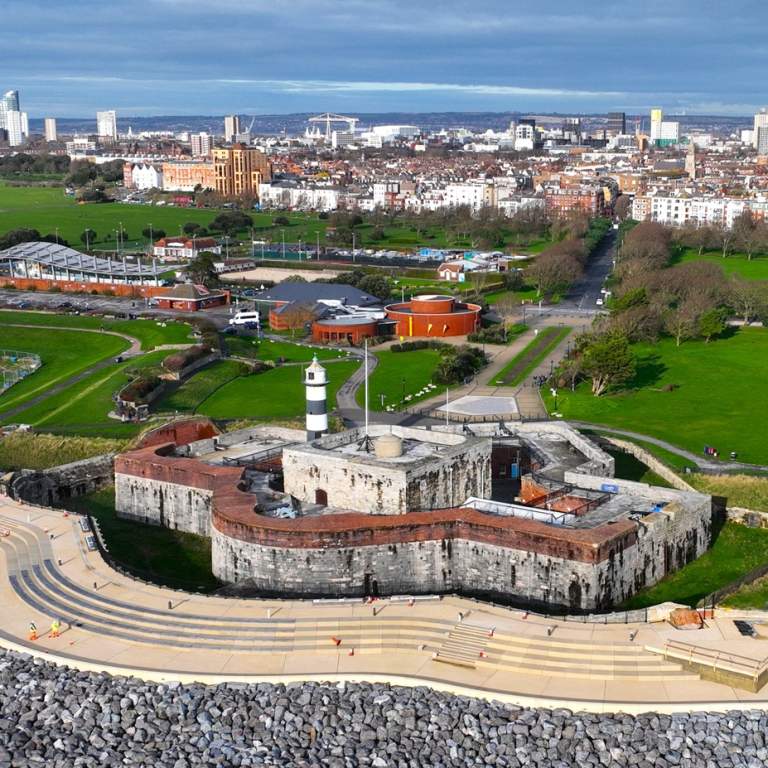 Aerial photograph looking out across the Theatre of the Sea, Southsea Castle, The D-Day Story and beyond over the Portsmouth cityscape.