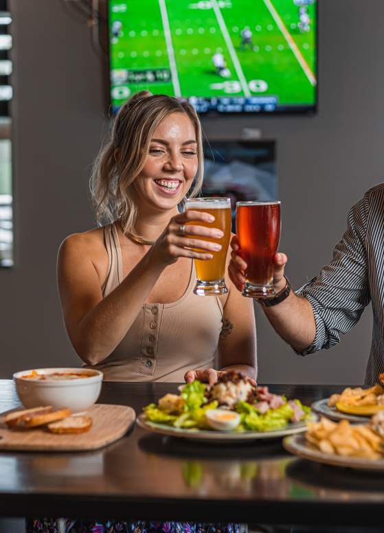 Couple toasting beer at Desperate Times