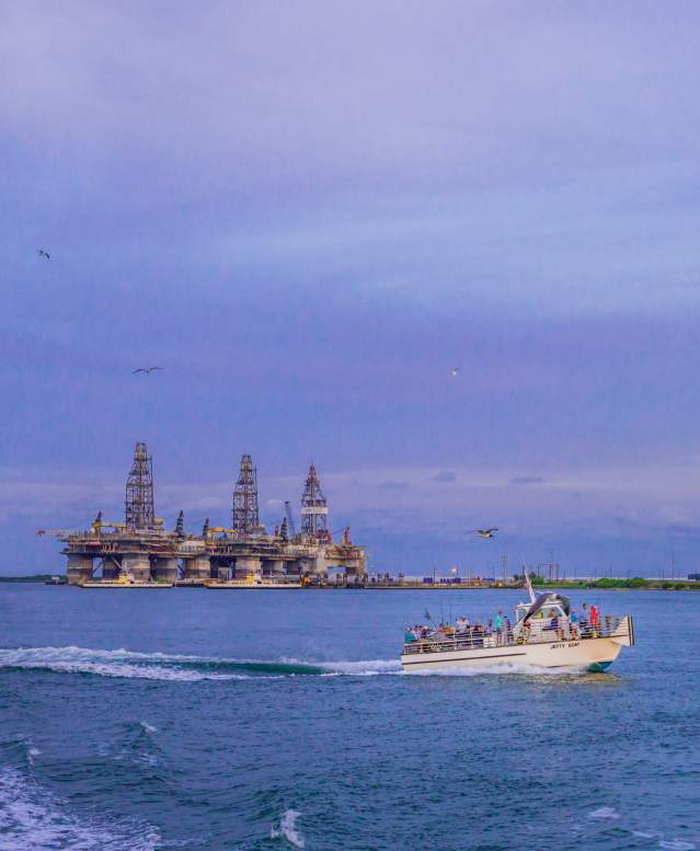 beach-san-jose-island-shannon-lafayette-chamber-port-aransas-texas-jetty-boat-front-of-oil-rig-platform