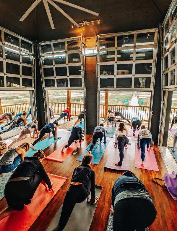 A group yoga class at Cattail Marsh Wetlands Education Center