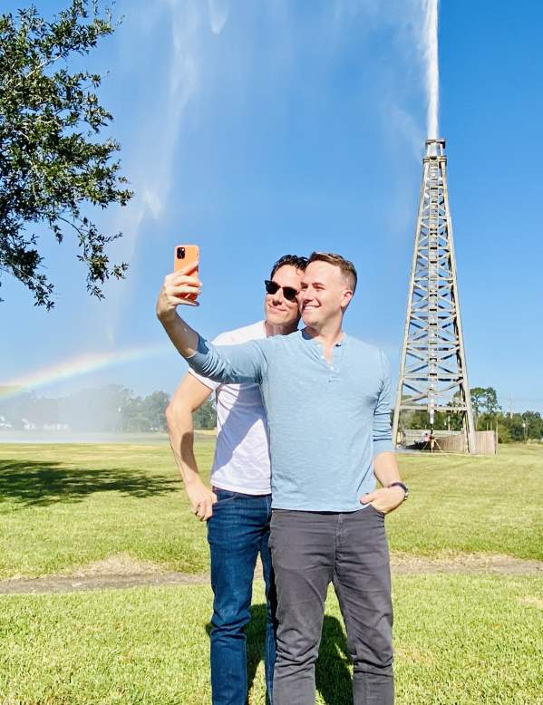 Couple taking selfie in front of the Spindletop Rainbow in Beaumont, TX