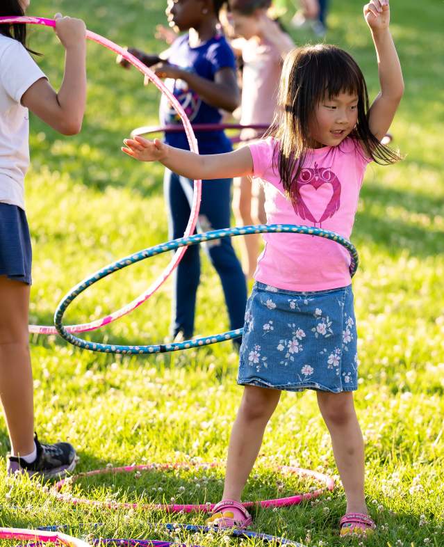 Kids hoola hooping at community event