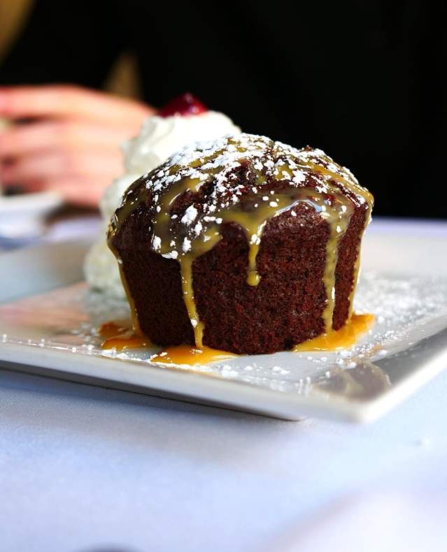 A chocolate cake drizzled in caramel.