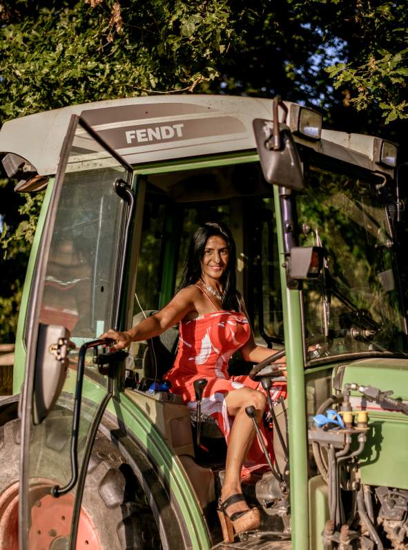 America of Oastbrook Vineyard sat in her tractor smiling