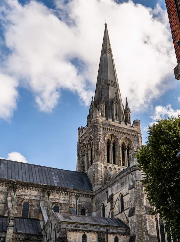 Exterior view of Chichester Cathedral from Chapel Street looking at the spire