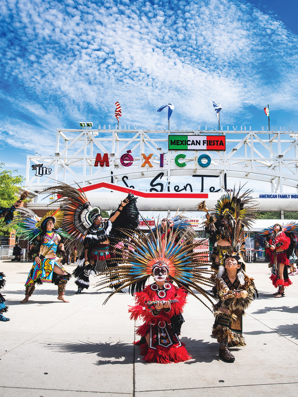 traditional Mexican dance in front of Mexican Fiesta festival grounds main gate