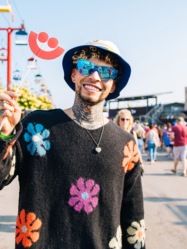 man smiling in a flower setting