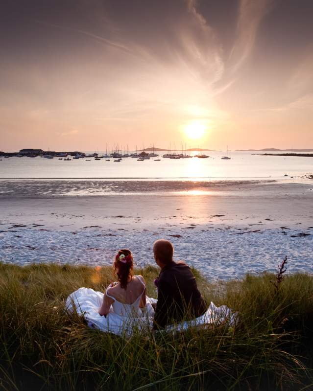 Wedding couple watching the sunset on St. Martin's