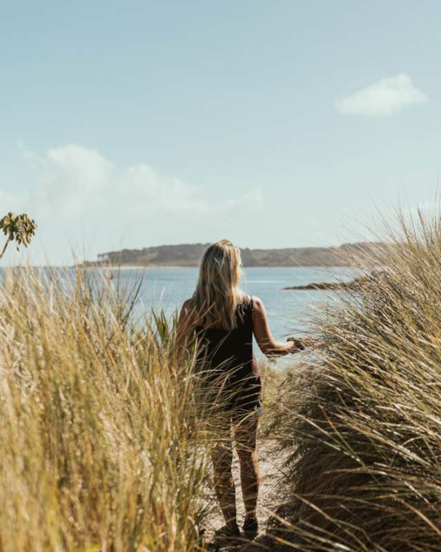 Girl on beach in autumn