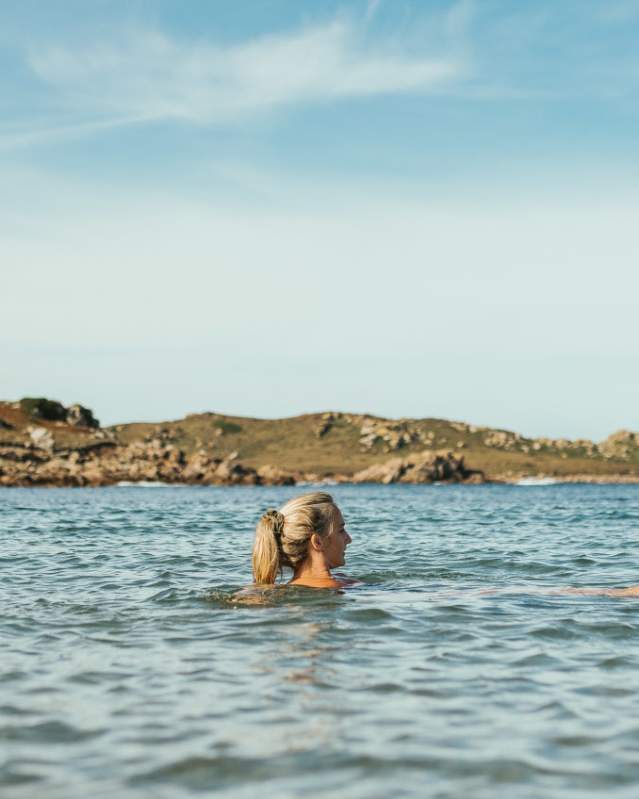 Woman swimming in Autumn