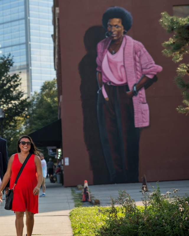 The mural of Indianapolis poet Mari Evans looms over visitors to Mass Ave